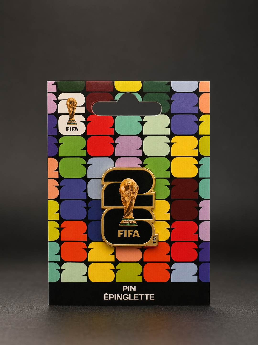 FIFA pin on a colorful packaging with a black background